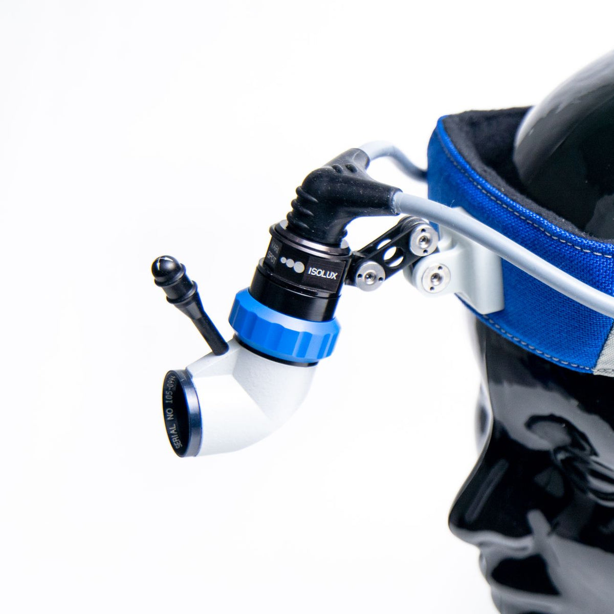 High-quality close-up of a surgical headlight on a mannequin in studio setting.