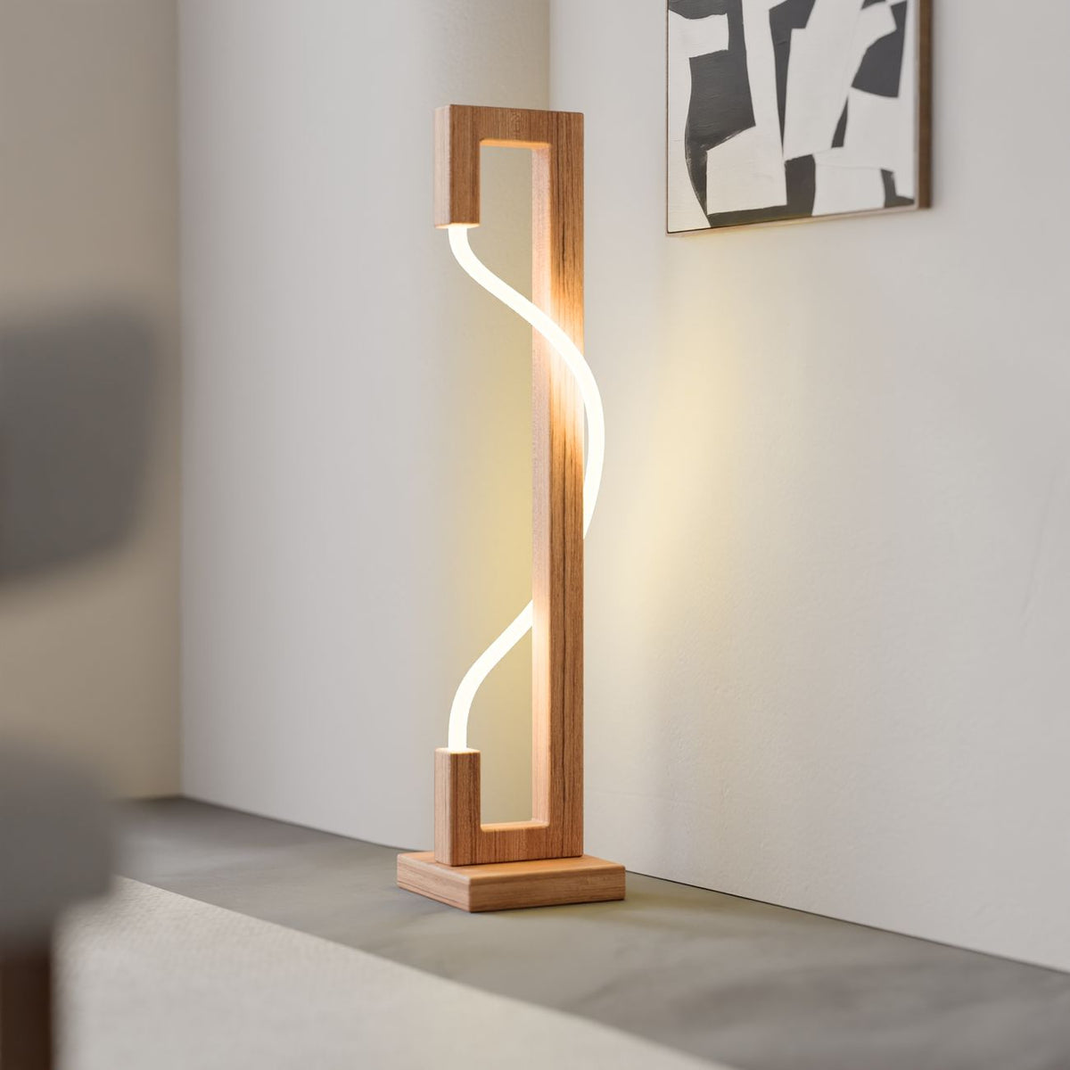 Sleek modern LED lamp with wooden frame in a minimalist interior design setting.