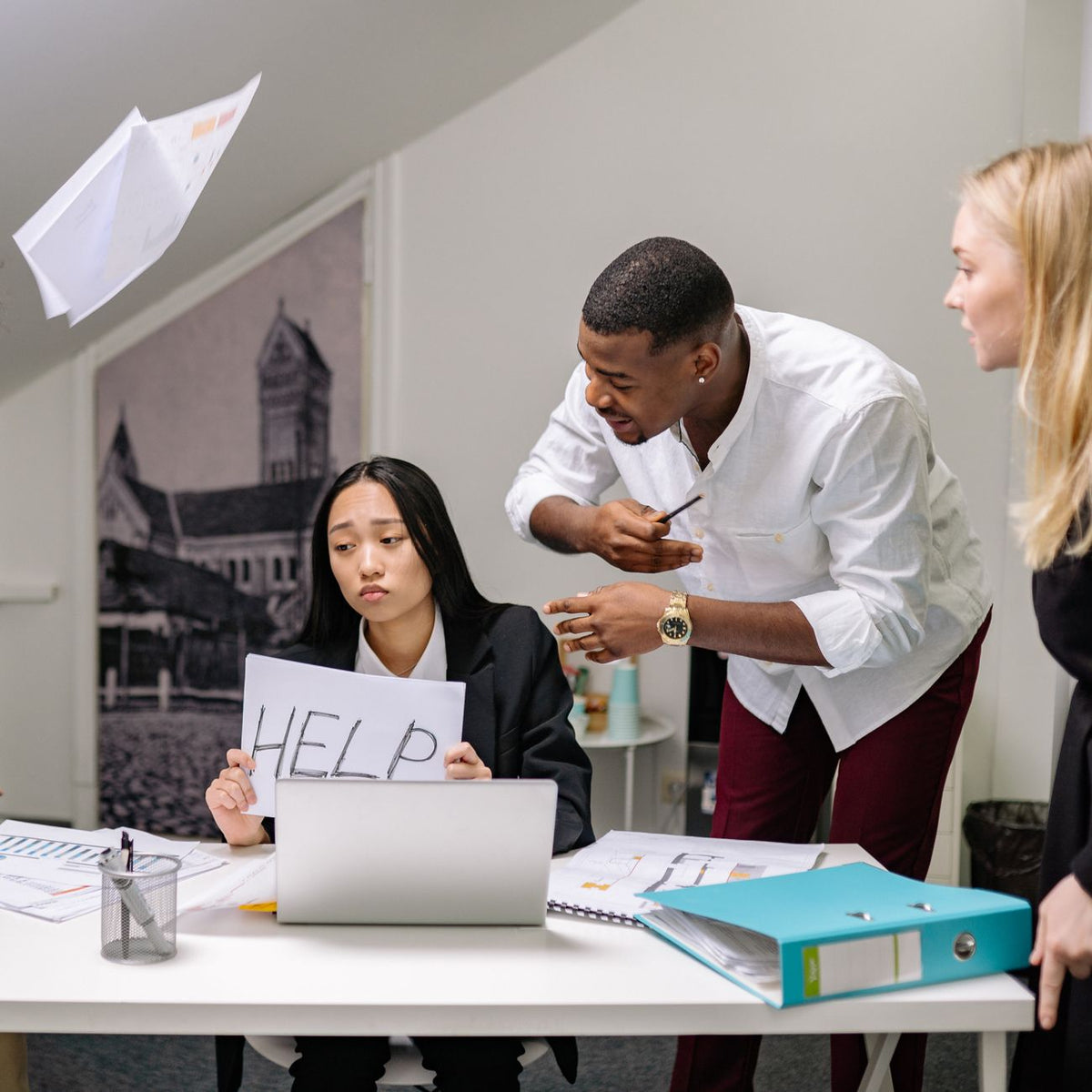 An image capturing office conflict with a woman seeking help and colleagues engaged in a tense discussion.