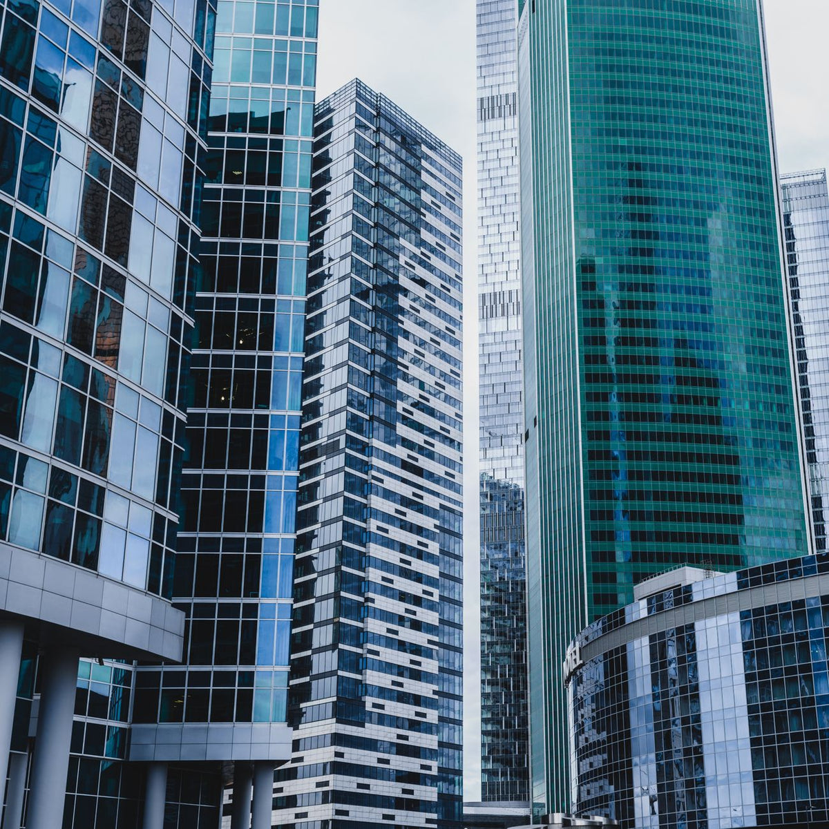 High-rise skyscrapers in an urban city setting, showcasing modern architecture and glass facades.